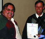 Jan van Wyk (left) receiving his Senior Member Certificate from Johan van Jaarsveldt